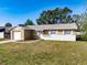 Charming single-story home featuring a blend of stucco and stone facade plus an attached single car garage at 428 Flamingo Dr, Apollo Beach, FL 33572