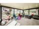 Enclosed lanai with windows and a concrete floor has ample space for storage and seating at 428 Flamingo Dr, Apollo Beach, FL 33572