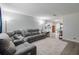 Bright living room featuring a large sectional sofa and open-concept design at 428 Flamingo Dr, Apollo Beach, FL 33572