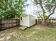 Exterior view of the storage shed in the backyard, providing convenient outdoor storage at 428 Flamingo Dr, Apollo Beach, FL 33572