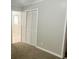 Bedroom with carpeted floors, white trim, and a closet at 4310 7Th S St, St Petersburg, FL 33705