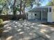 Spacious carport and driveway area offer convenient parking and backyard access at 4310 7Th S St, St Petersburg, FL 33705