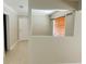 Hallway with tile flooring and an opening overlooking another room at 4310 7Th S St, St Petersburg, FL 33705