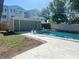 Poolside lounging area showcasing a covered seating space and a clear blue pool at 4310 7Th S St, St Petersburg, FL 33705