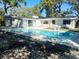 Backyard featuring a refreshing pool, perfect for relaxation and outdoor entertainment at 4310 7Th S St, St Petersburg, FL 33705