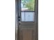 Back door with pet door insert providing backyard access at 4550 53Rd N Ave, St Petersburg, FL 33714