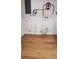 Basement features plumbing and water heater against a white wall and wood flooring at 4550 53Rd N Ave, St Petersburg, FL 33714