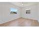 Minimalist bedroom with light wood floors, neutral paint, and lots of natural light at 4550 53Rd N Ave, St Petersburg, FL 33714