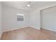 Bright bedroom with light wood floors, closet, and ceiling fan at 4550 53Rd N Ave, St Petersburg, FL 33714