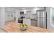 Renovated kitchen featuring white cabinets, butcher block counters, and stainless steel appliances at 4550 53Rd N Ave, St Petersburg, FL 33714