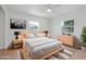 Staged main bedroom featuring modern decor and natural light from two windows at 4550 53Rd N Ave, St Petersburg, FL 33714