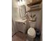 Cozy bathroom features a white vanity, decorative mirror, and modern fixtures at 4601 N 38Th St, Tampa, FL 33610