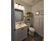Charming bathroom features modern fixtures, open shelving, and stylish framed artwork, perfect for a cozy feel at 4601 N 38Th St, Tampa, FL 33610