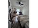 Well-lit bedroom has wood-look floors, closet and ceiling fan at 4601 N 38Th St, Tampa, FL 33610