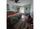 This cozy bedroom with laminate wood flooring boasts an accent wall and natural light from the bright window at 4601 N 38Th St, Tampa, FL 33610