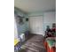 Bedroom featuring hardwood floors, double closets, and an accent wall at 4601 N 38Th St, Tampa, FL 33610