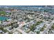 Aerial view of a neighborhood with many trees with a view of the bay at 512 79Th Ave, St Pete Beach, FL 33706