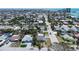 Aerial view showcasing a neighborhood with mature trees and nearby waterways at 512 79Th Ave, St Pete Beach, FL 33706