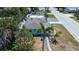 Aerial view of a light blue house with a gray roof and mature landscaping at 512 79Th Ave, St Pete Beach, FL 33706