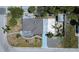 Aerial view of the home with mature trees, nice yard, and street access at 512 79Th Ave, St Pete Beach, FL 33706