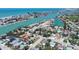 An aerial view showing a canal and the area's many waterfront properties at 512 79Th Ave, St Pete Beach, FL 33706
