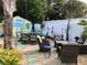 Inviting backyard with beach themed shed, outdoor dining and seating areas at 512 79Th Ave, St Pete Beach, FL 33706