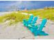 Relax on the beach in Adirondack chairs with beautiful views of the sand and ocean at 512 79Th Ave, St Pete Beach, FL 33706