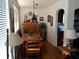Sunlit dining room featuring hardwood floors, a wooden table set, and an archway at 512 79Th Ave, St Pete Beach, FL 33706