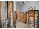 Interior shot of a room undergoing significant remodeling, revealing exposed framing and unfinished surfaces at 512 79Th Ave, St Pete Beach, FL 33706