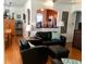 Cozy living room showcasing hardwood floors, seating, and an arched doorway to the kitchen at 512 79Th Ave, St Pete Beach, FL 33706
