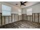 View of a room, showcasing its unfinished interior, featuring exposed walls and hardwood flooring at 512 79Th Ave, St Pete Beach, FL 33706