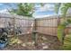 Cozy backyard featuring a wooden fence and bird bath at 5814 Silver Moon Ave, Tampa, FL 33625