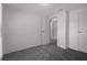 Bedroom featuring neutral carpet, white walls, and closet doors at 5814 Silver Moon Ave, Tampa, FL 33625