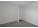 Simple, clean bedroom featuring neutral walls and flooring, and a small closet area at 5814 Silver Moon Ave, Tampa, FL 33625