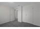 Carpeted bedroom features two closets and neutral walls at 5814 Silver Moon Ave, Tampa, FL 33625