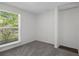 Neutral bedroom with a large window offering ample natural light and a closet nook at 5814 Silver Moon Ave, Tampa, FL 33625
