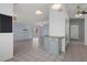 Cozy kitchen area with tile flooring, blue cabinetry, and sliding glass doors that lead to the outside at 5814 Silver Moon Ave, Tampa, FL 33625