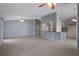 Bright and airy living space featuring tile flooring, ceiling fans, and seamless access to the kitchen at 5814 Silver Moon Ave, Tampa, FL 33625