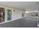 Spacious screened patio with backyard view, accessible through sliding glass doors at 5814 Silver Moon Ave, Tampa, FL 33625