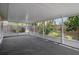 Spacious covered patio overlooking the backyard with lush greenery and privacy fence at 5814 Silver Moon Ave, Tampa, FL 33625