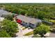 An aerial view of a multi-Gathering building with mature trees at 6462 92Nd N Pl # 804, Pinellas Park, FL 33782