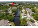 Beautiful aerial view of a charming waterfront community featuring lush landscaping and a refreshing community pool at 6462 92Nd N Pl # 804, Pinellas Park, FL 33782
