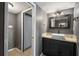 A bathroom featuring dark cabinets, neutral granite counters and ceramic tile floors at 6462 92Nd N Pl # 804, Pinellas Park, FL 33782