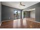 This bedroom boasts wood floors, a ceiling fan and a sliding glass door for bright natural light at 6462 92Nd N Pl # 804, Pinellas Park, FL 33782