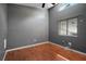 Minimalist bedroom featuring hardwood floors, a window and neutral gray walls at 6462 92Nd N Pl # 804, Pinellas Park, FL 33782