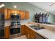 Modern kitchen with stainless steel appliances, tile backsplash and breakfast bar at 6462 92Nd N Pl # 804, Pinellas Park, FL 33782