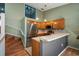 Bright kitchen featuring stainless steel appliances, breakfast bar and wood cabinetry at 6462 92Nd N Pl # 804, Pinellas Park, FL 33782