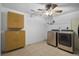 Laundry room with neutral washer and dryer next to white walls and storage at 6462 92Nd N Pl # 804, Pinellas Park, FL 33782