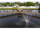 An aerial view of a fountain in a pond that has a rainbow in the spray at 6462 92Nd N Pl # 804, Pinellas Park, FL 33782