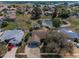 Aerial view of home in a community with a pond at 8742 Bermuda Ln, Port Richey, FL 34668